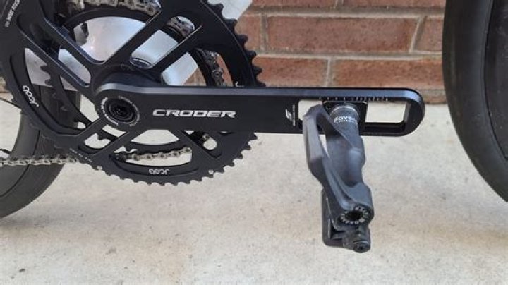 What does a crank arm attach to on a bike?